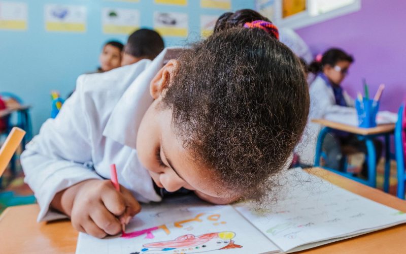 CASABLANCA, MOROCCO - Mars 14, 2017: Cute little moroccan child drawing at shcool, morocco, maroc