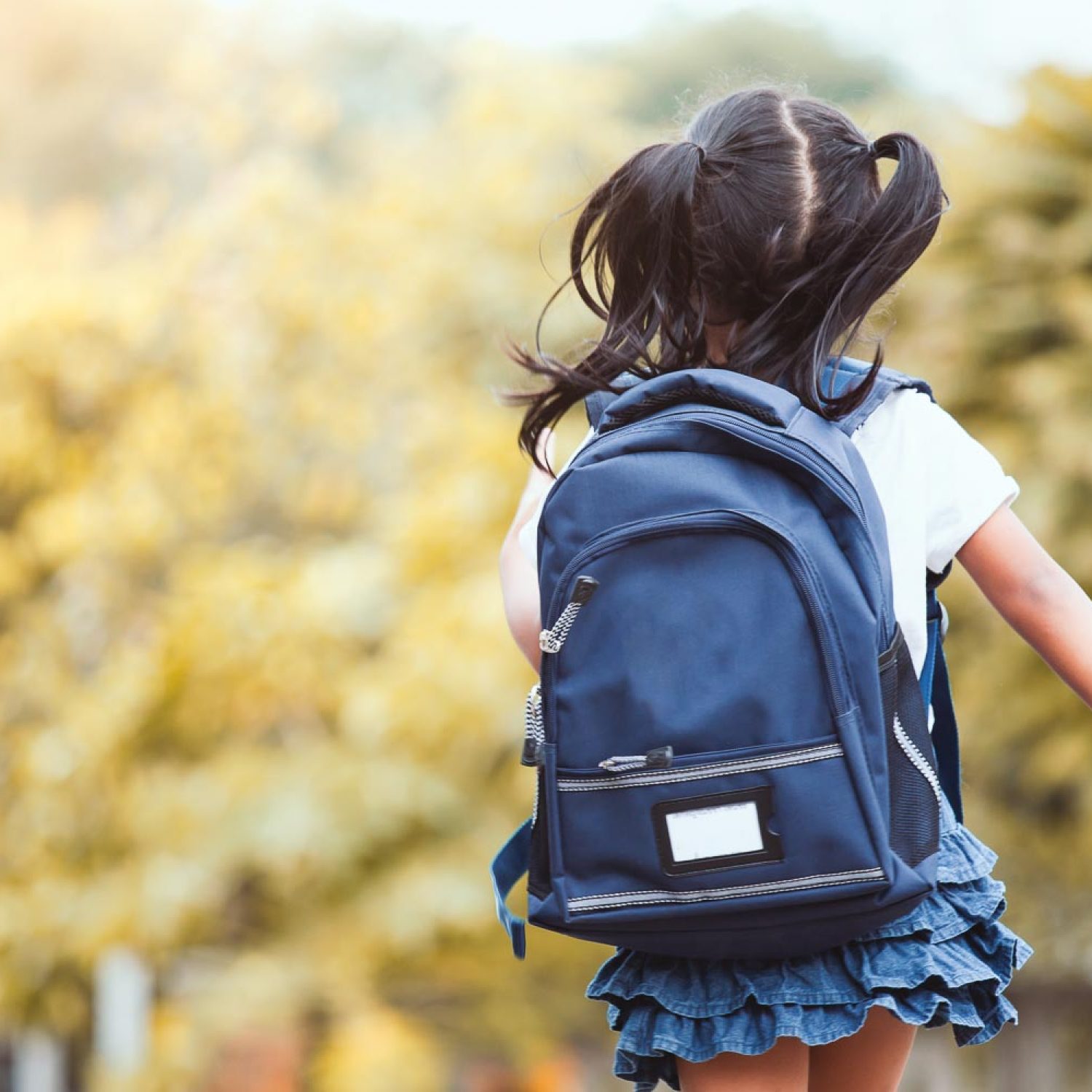 Back to school. Cute asian child girl with backpack running and going to school with fun