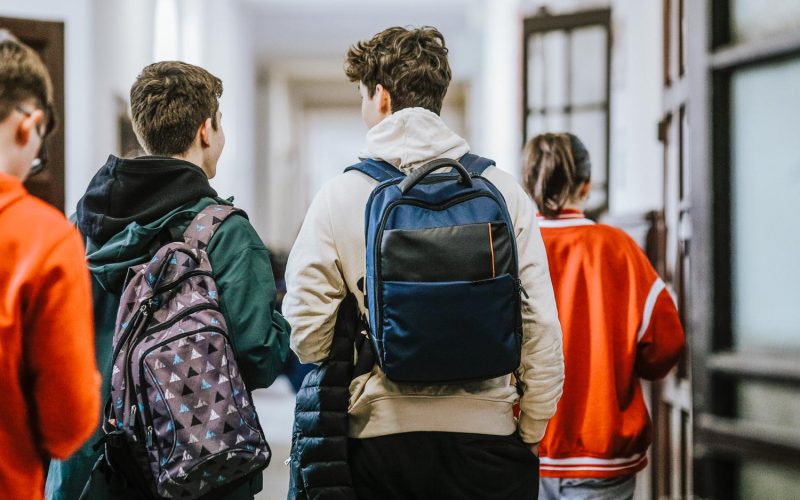 Bucharest, Romania - April 11, 2022: High school students in the hallway of a Bucharest old high school during break.