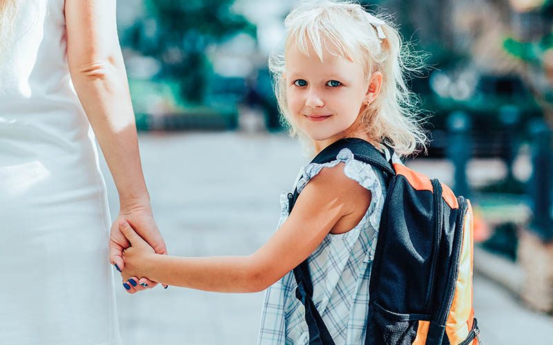 Content Schoolgirl Holding Mother Hand